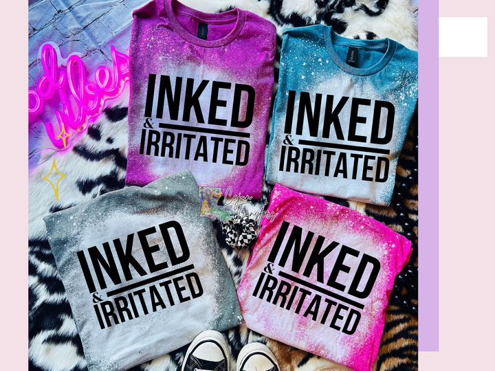 three t - shirts that say inked and irritated