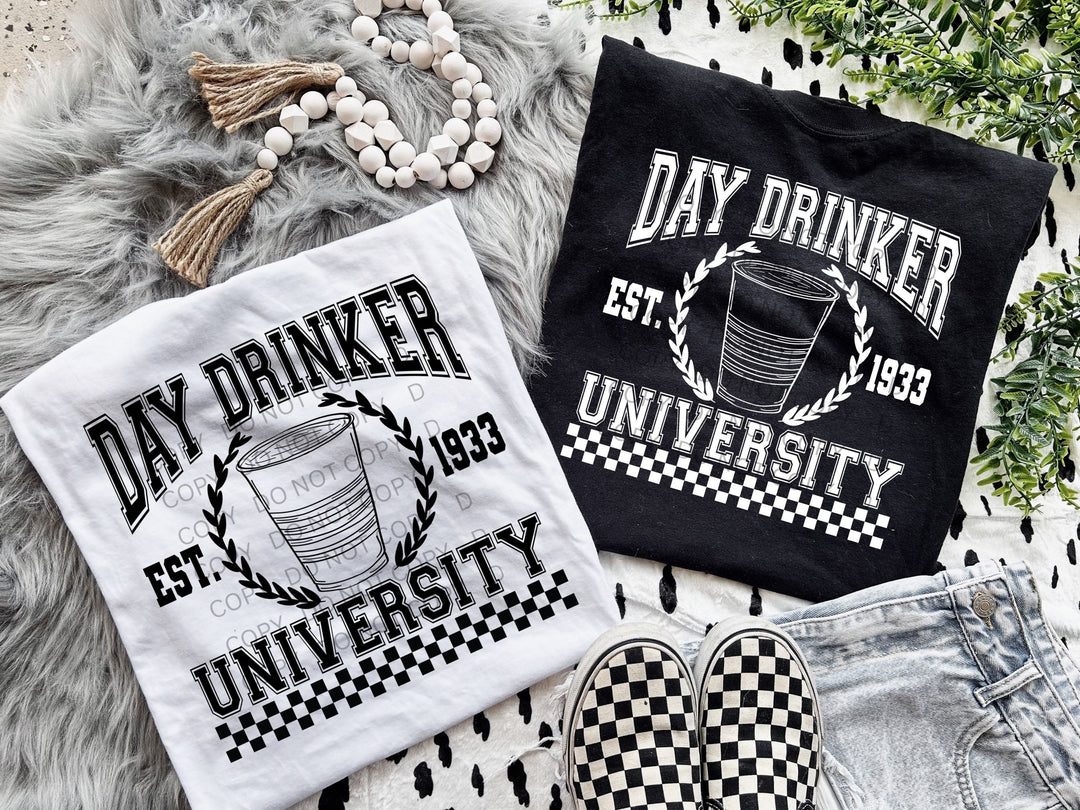 two t - shirts that say day drinker, eat university and a pair of
