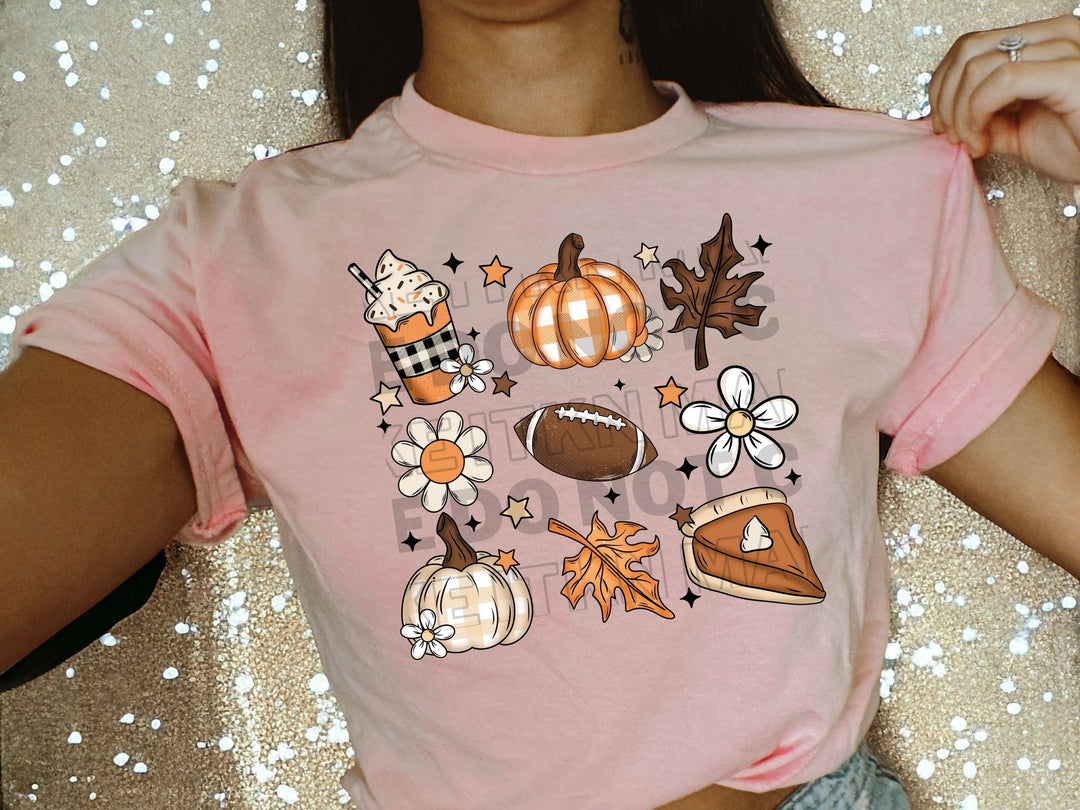 a woman wearing a pink shirt with a bunch of fall items on it