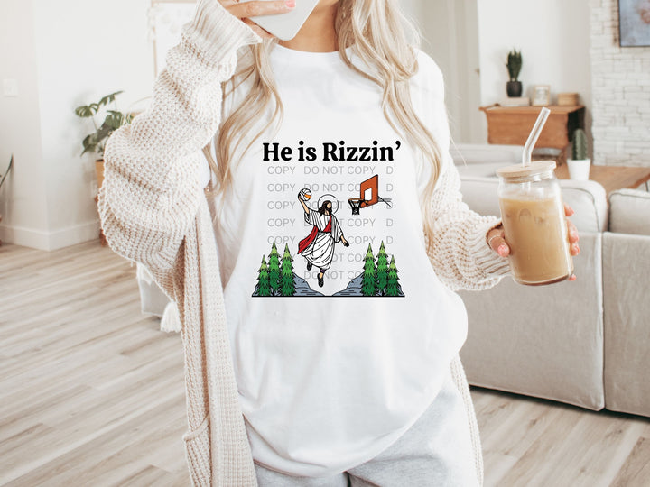 a woman holding a cup of coffee and wearing a t - shirt