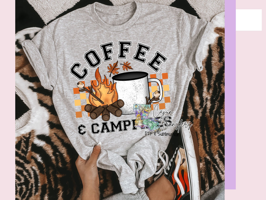 a person holding a coffee mug on top of a bed
