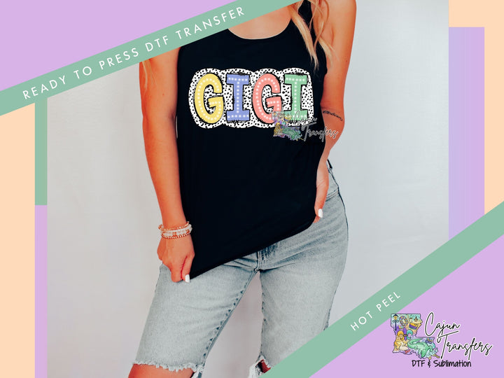a woman wearing a black t - shirt with the word get glit on it