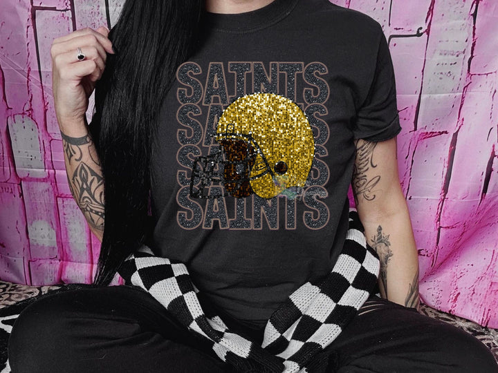 a woman with long black hair wearing a saints saints shirt