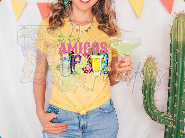 a woman in a yellow shirt holding a drink