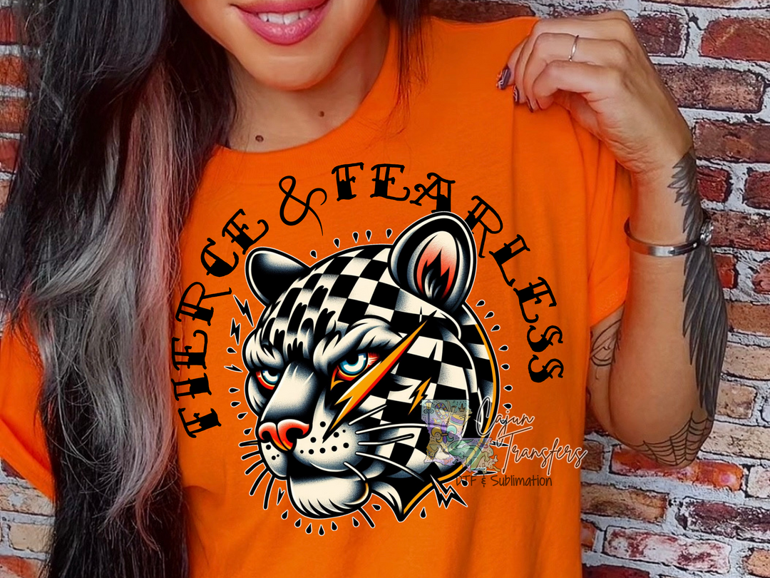 a woman wearing an orange shirt with a black and white tiger on it
