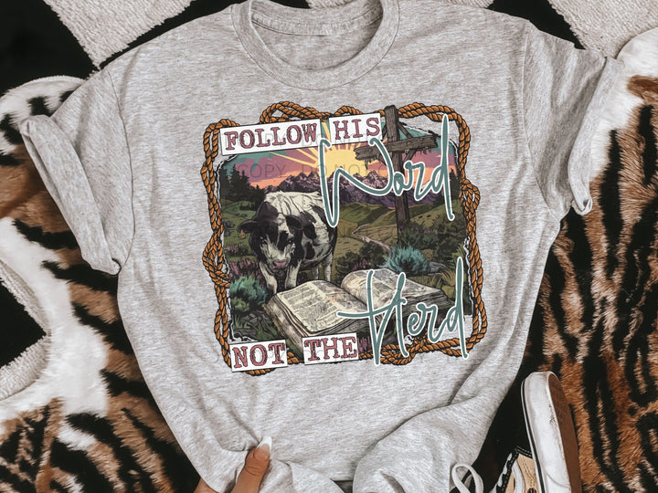 a t - shirt with a picture of a cow on it