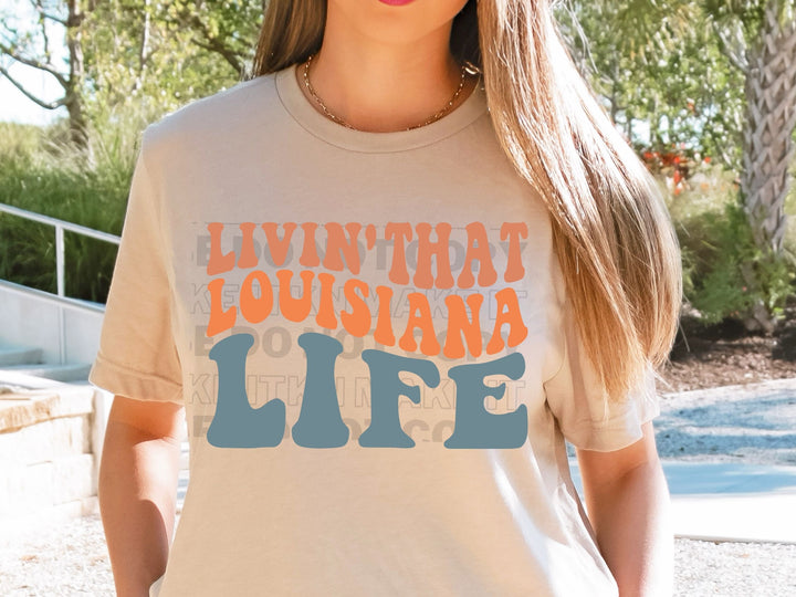 a woman wearing a t - shirt that says livin't that louisiana life