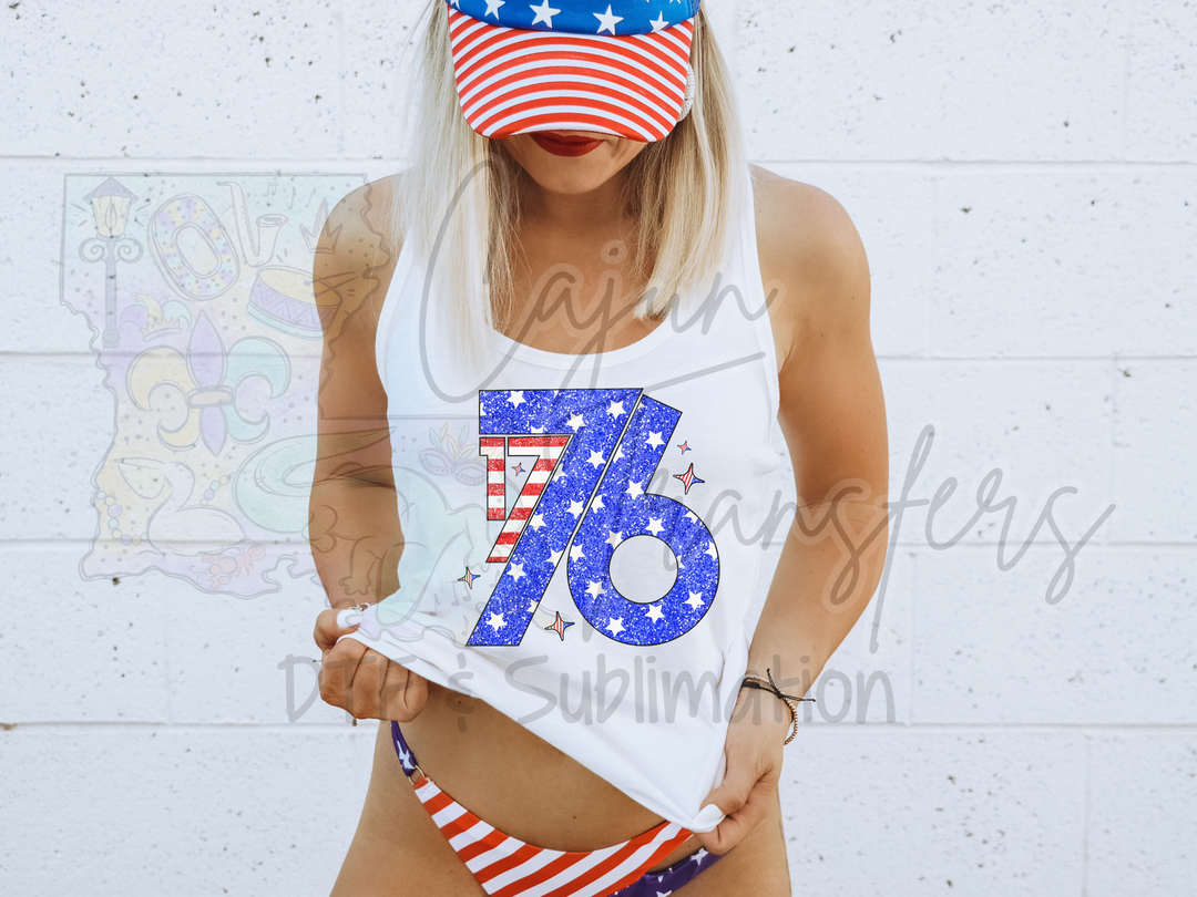 a woman wearing a patriotic hat holding a t - shirt