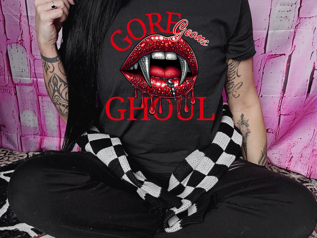 a woman wearing a black shirt with a red lip on it