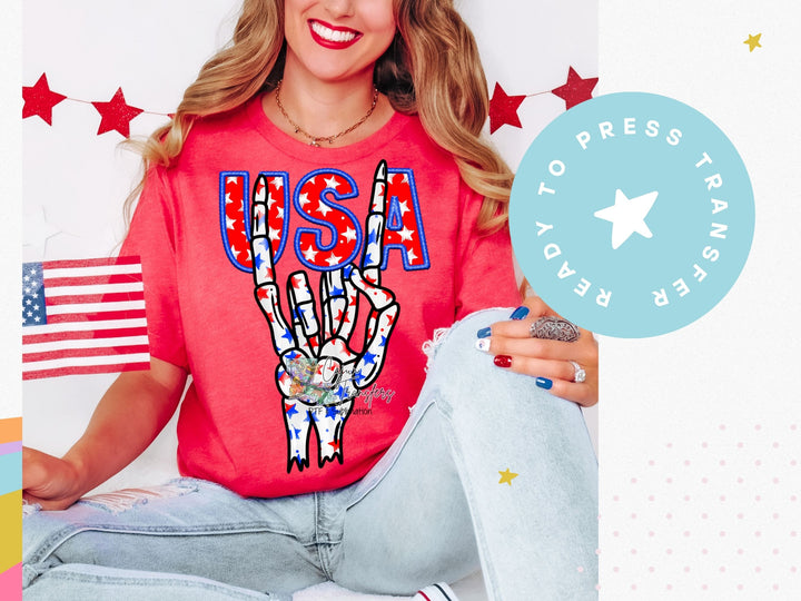 a woman in a red shirt is holding a peace sign