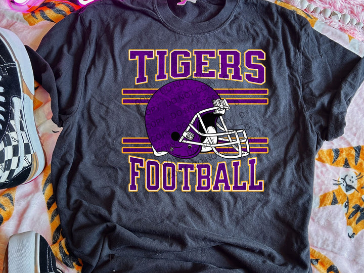 a t - shirt with a football helmet on it