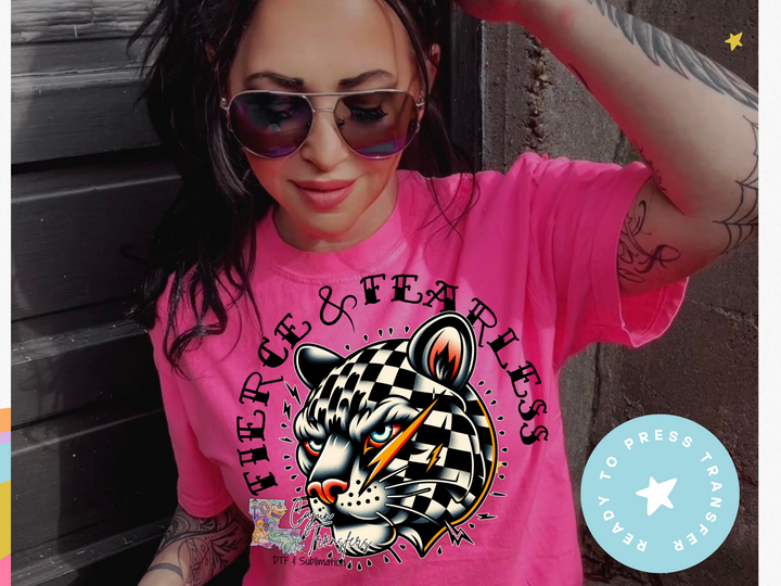 a woman wearing a pink shirt with a tiger on it