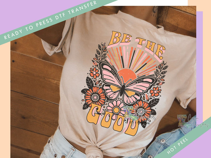 a woman wearing a t - shirt that says be the good
