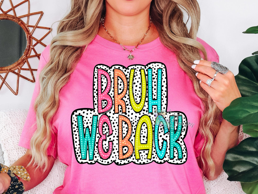 a woman wearing a pink shirt that says proud welakk