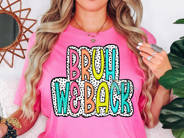 a woman wearing a pink shirt that says proud welakk