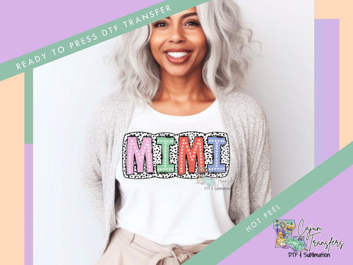 a woman with grey hair wearing a white shirt with the word meme on it