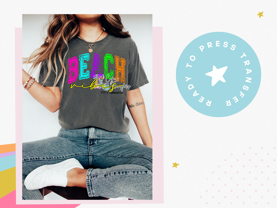 a woman wearing a t - shirt with the word beach printed on it