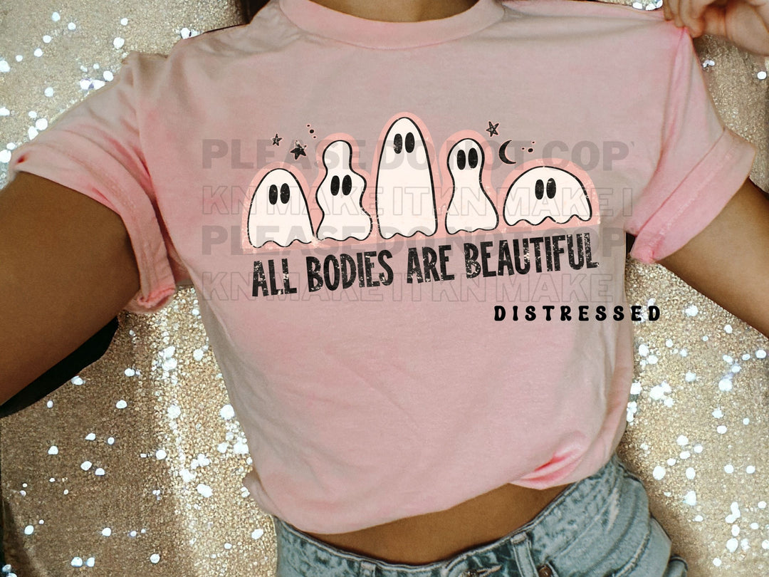 a woman wearing a pink shirt that says all bodies are beautiful