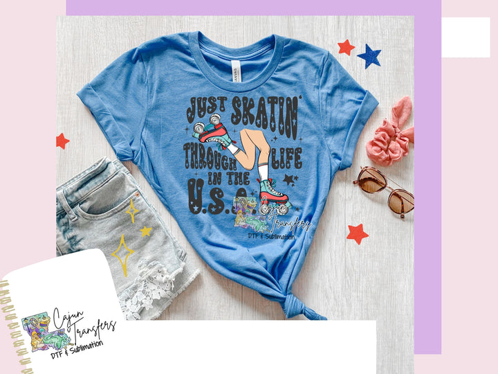 a women's blue shirt with a picture of a woman's legs and