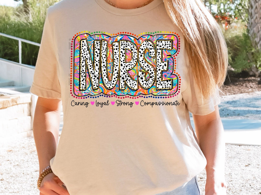 a woman wearing a nurse t - shirt with the word nurse on it