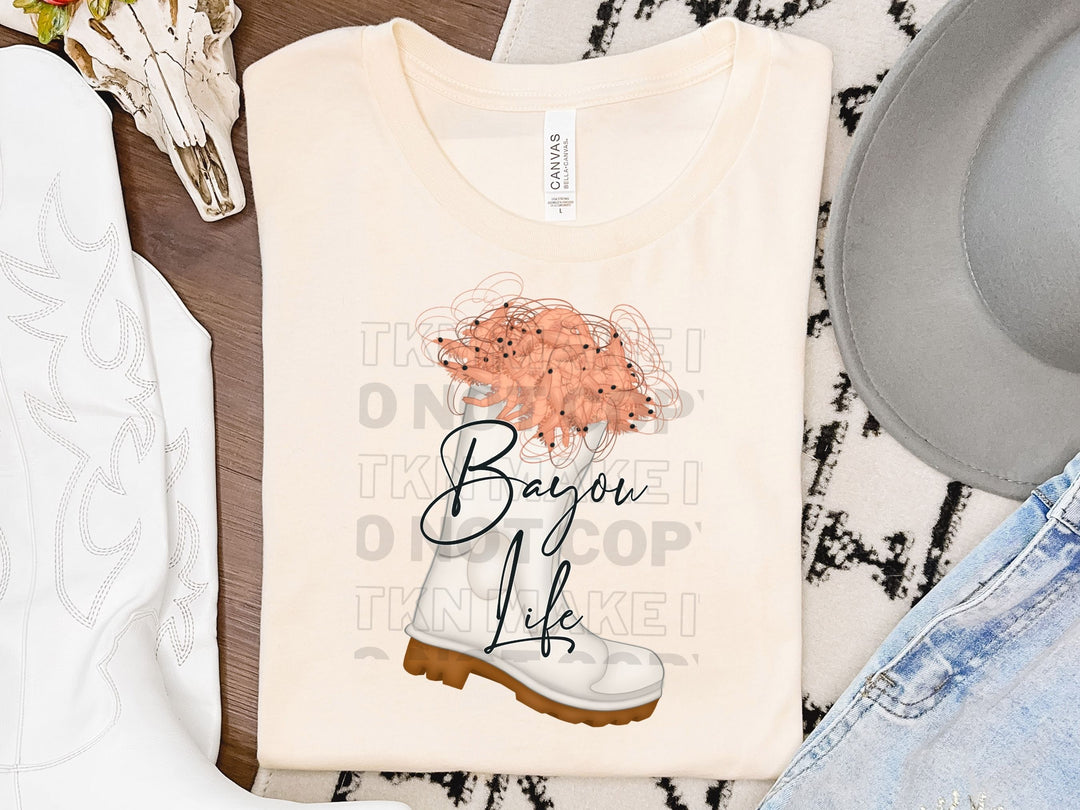 a pair of jeans, a cowboy hat, and a t - shirt on a