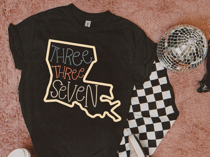 a t - shirt that says three three seven on it