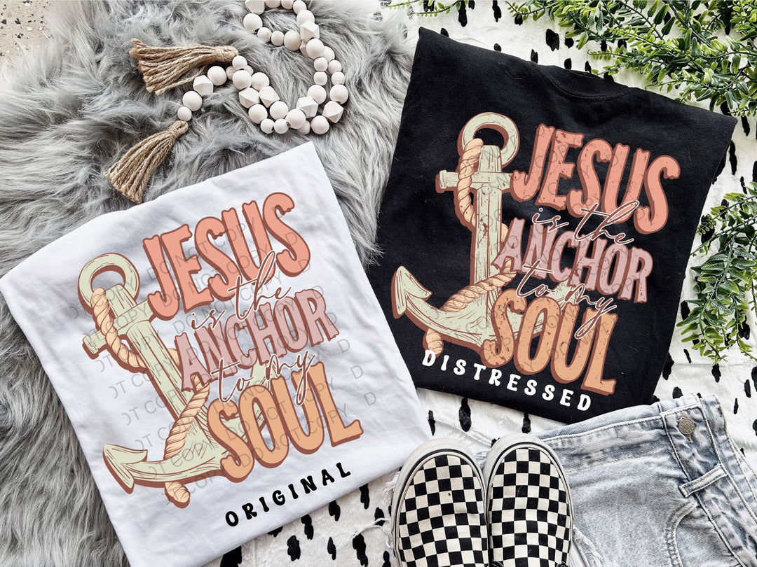 two t - shirts and a pair of shoes on a rug
