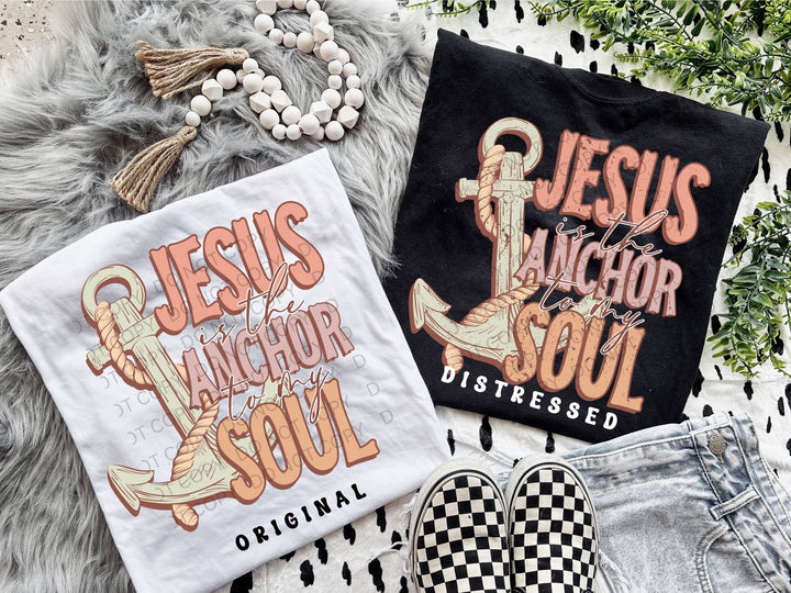 two t - shirts and a pair of shoes on a rug