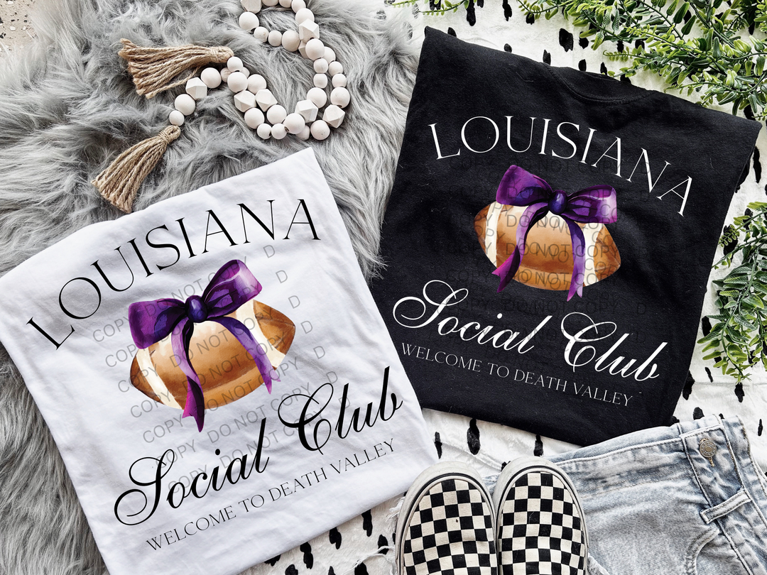 two t - shirts and a pair of slippers are laying on a blanket