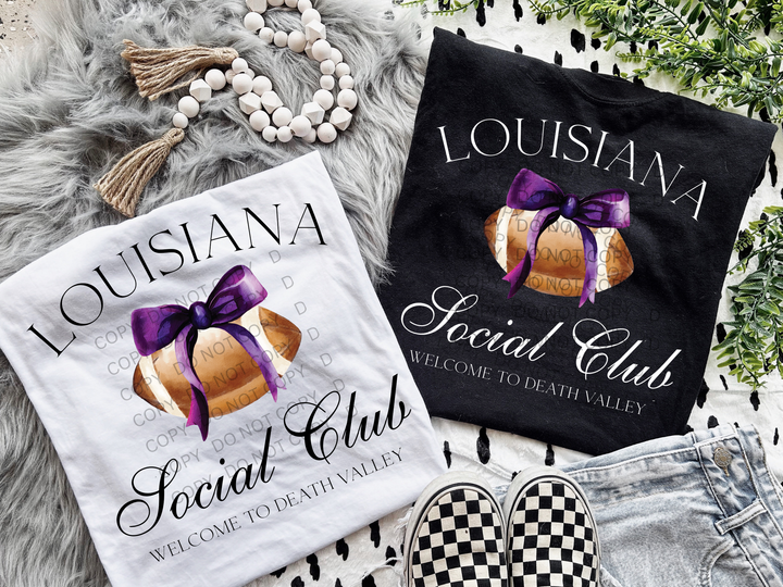 two t - shirts and a pair of slippers are laying on a blanket