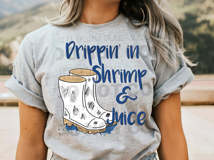 a woman wearing a t - shirt with a picture of a pair of boots on