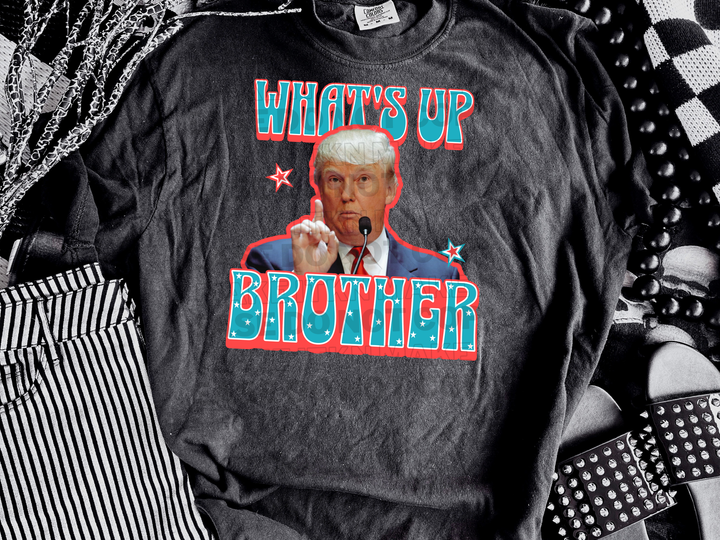 a black t - shirt with a picture of bill clinton on it