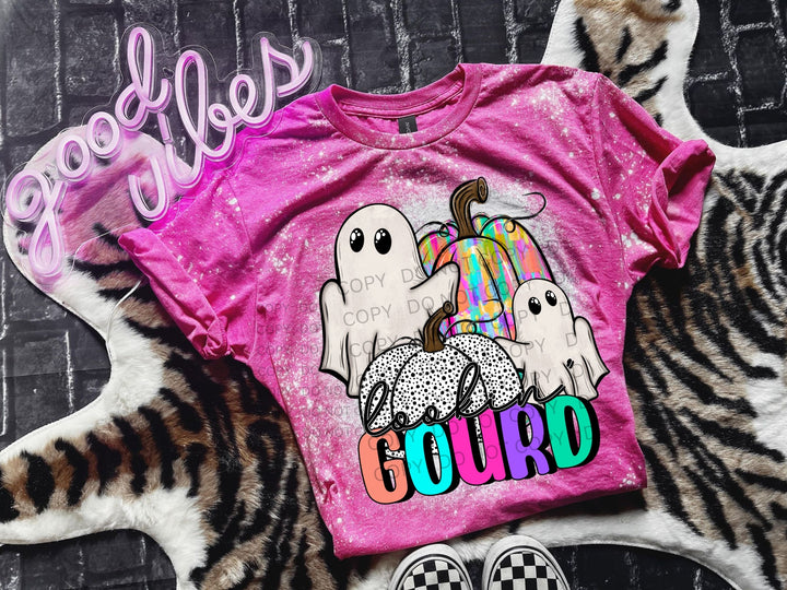 a pink t - shirt with three ghostes on it