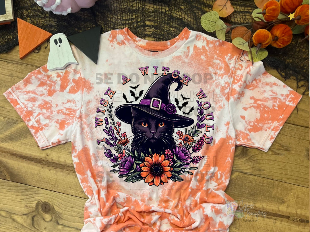 a black cat wearing a witches hat on a tie dye shirt