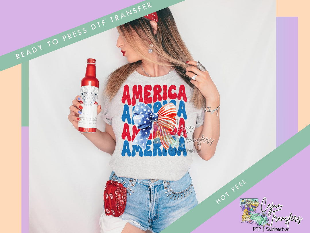 a woman holding a bottle of beer and wearing a t - shirt that says america