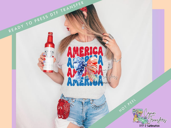 a woman holding a bottle of beer and wearing a t - shirt that says america