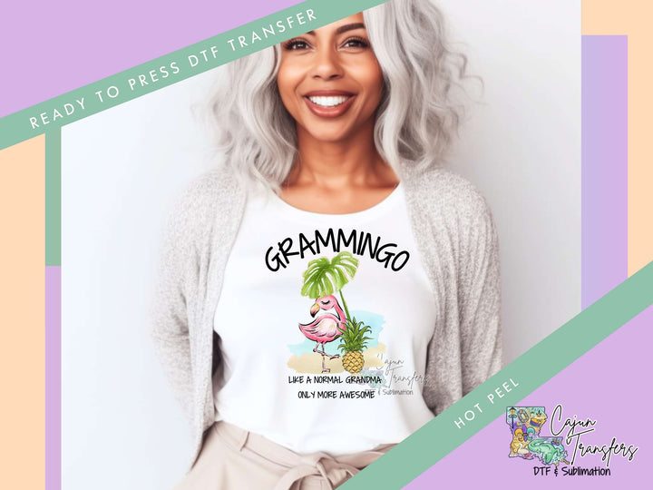 a woman wearing a white shirt with a pink flamingo on it