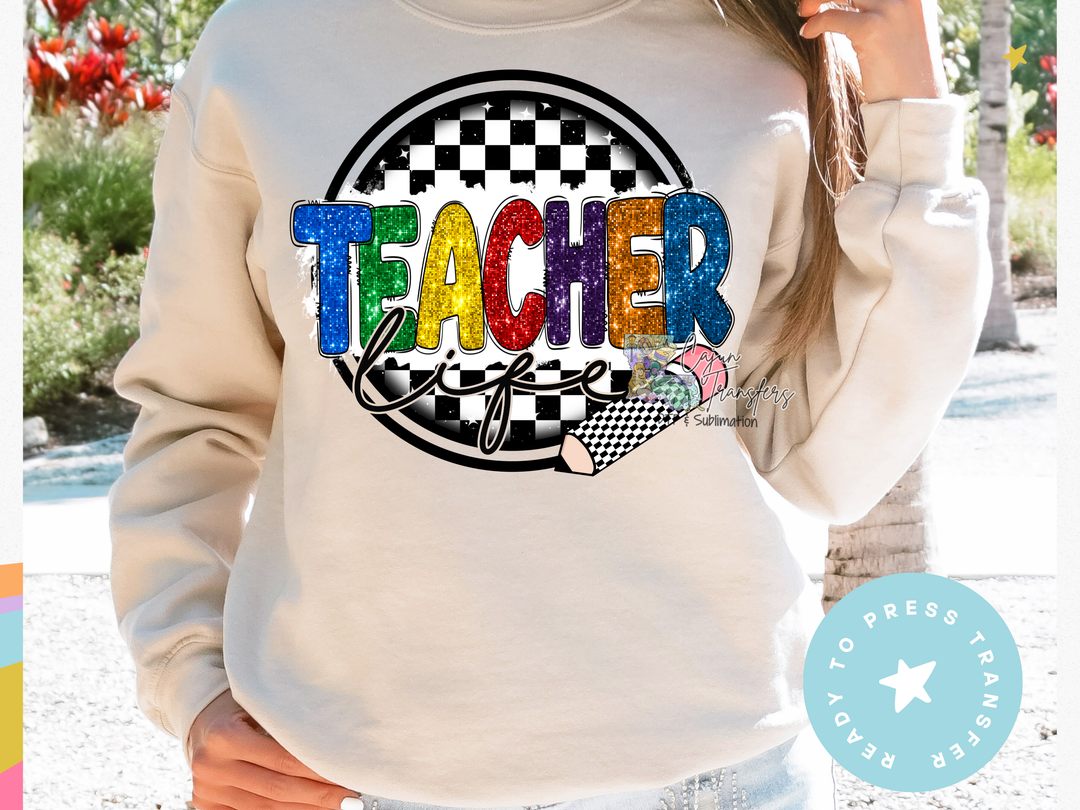 a woman wearing a sweatshirt with the word teacher printed on it
