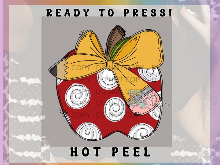 a picture of an apple with a yellow bow