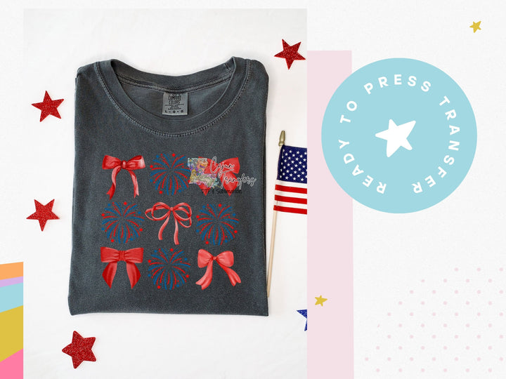 a gray shirt with red bows and a american flag