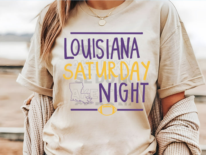 a woman wearing a t - shirt that says, louisiana saturday night