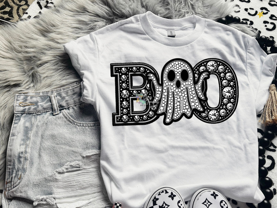 a white shirt with the word boo on it