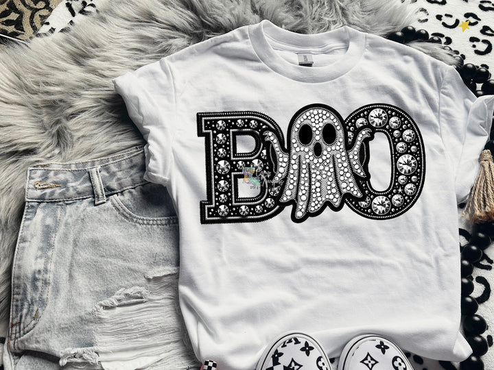 a white shirt with the word boo on it