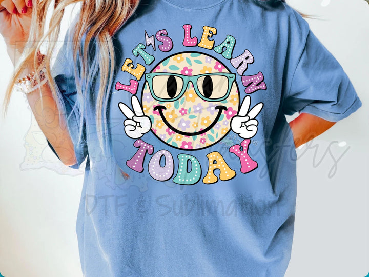 a woman wearing a blue shirt with a donut on it