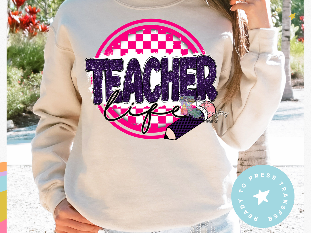 a woman wearing a sweatshirt that says teacher life