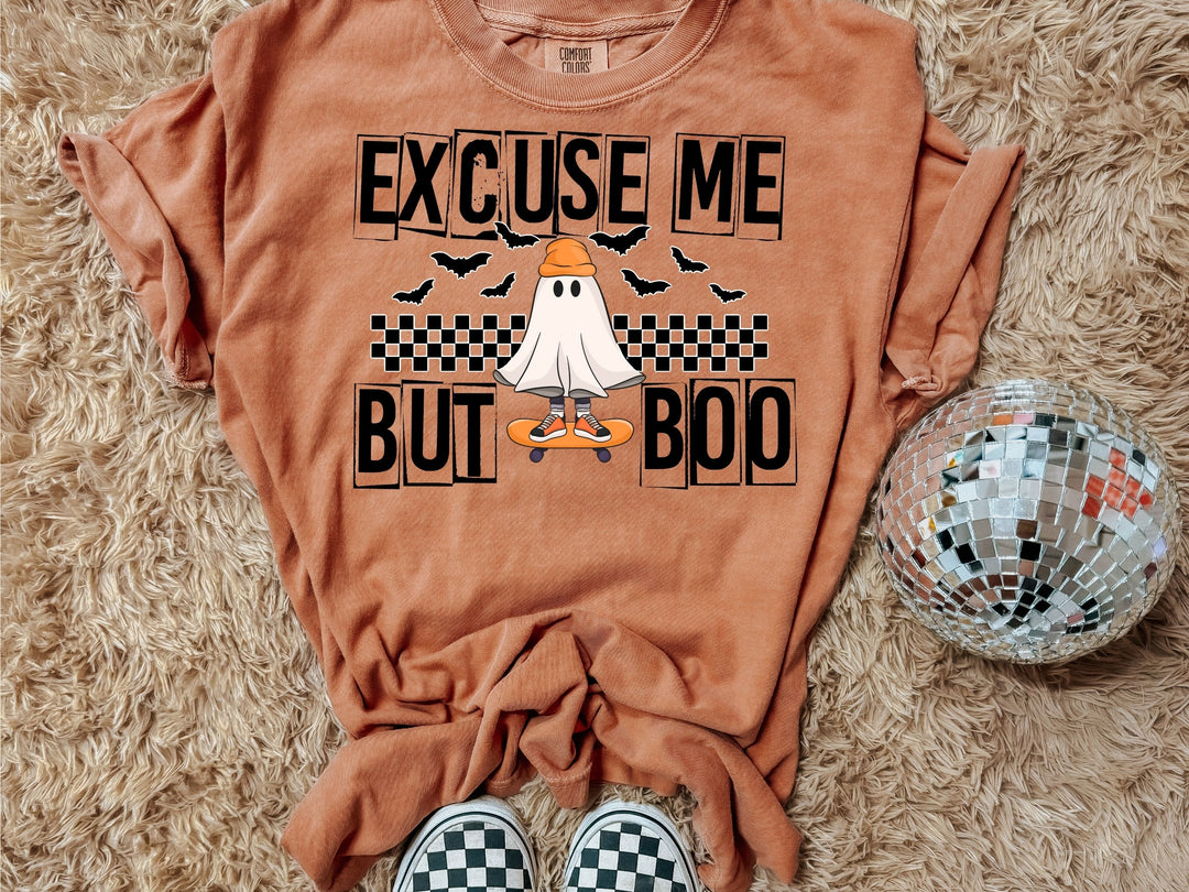 a t - shirt with a ghost riding a skateboard