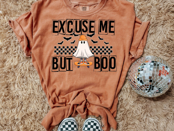 a t - shirt with a ghost riding a skateboard