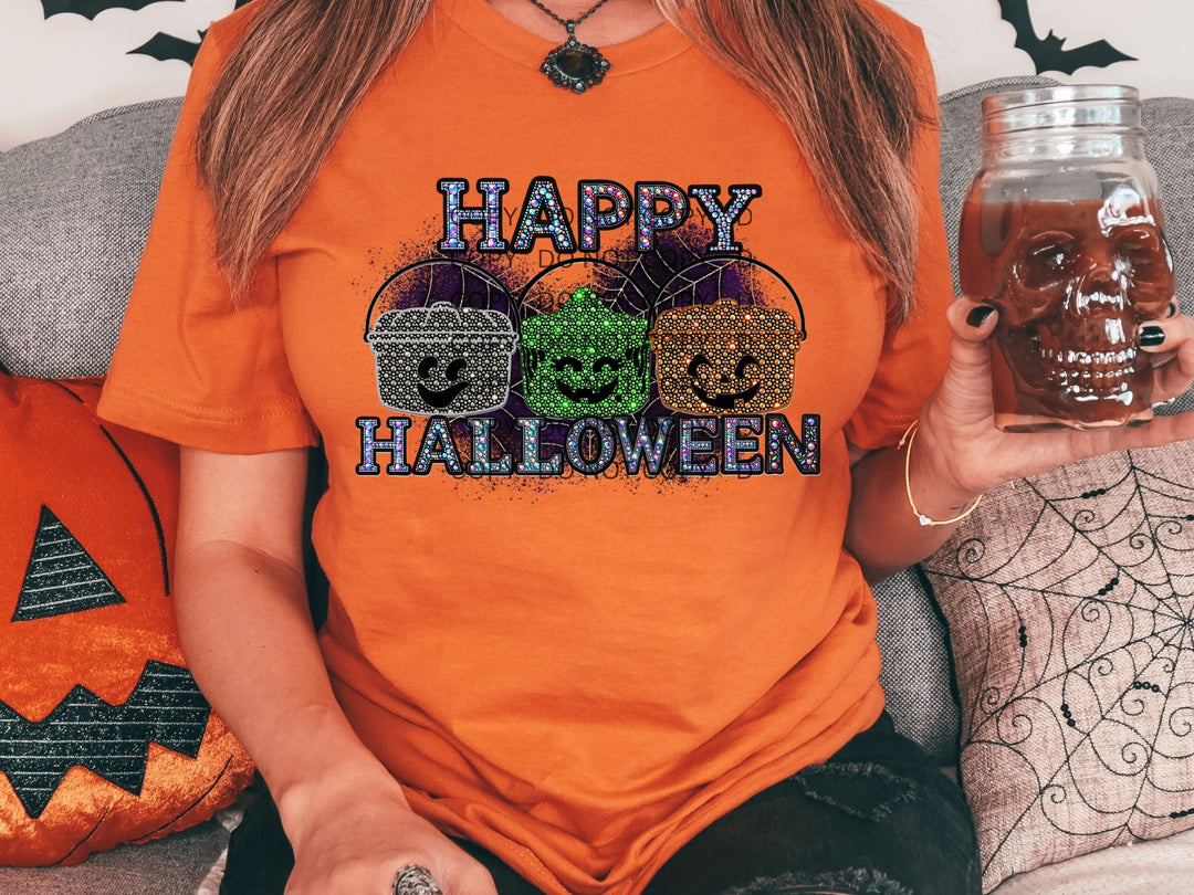 a woman wearing an orange happy halloween t - shirt holding a jar of booze