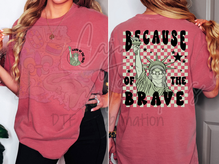 a woman wearing a pink tshirt with the statue of liberty on it