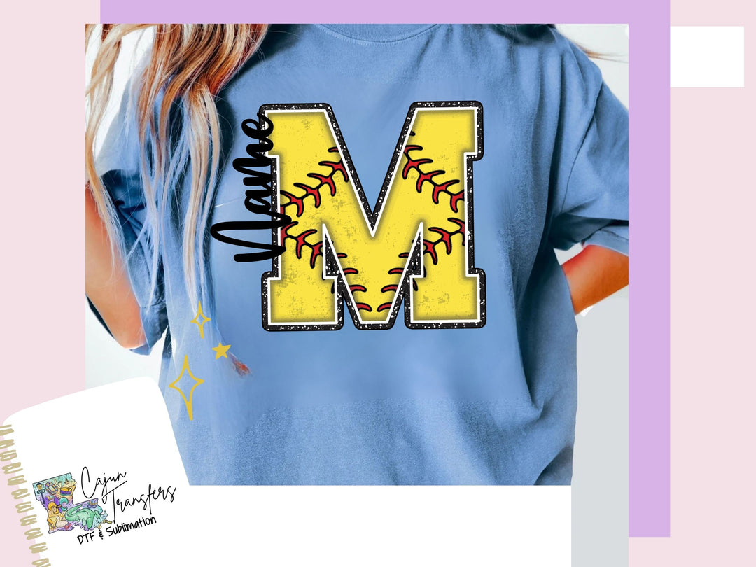 a woman wearing a blue shirt with a baseball on it